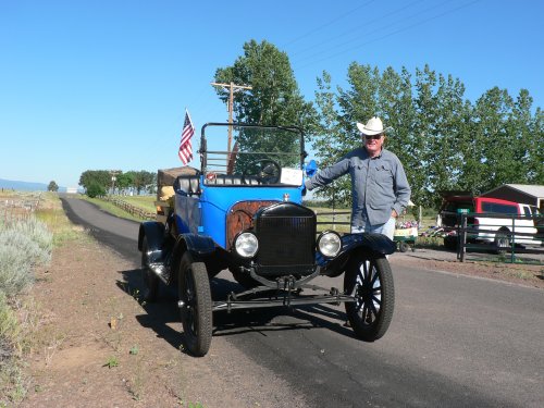 A Blue Model T with owner