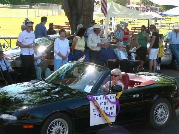 In her old convertable, is our lady citizen of the year.