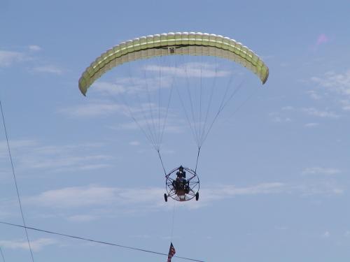 A powered hang glider directly above with "para-wing"