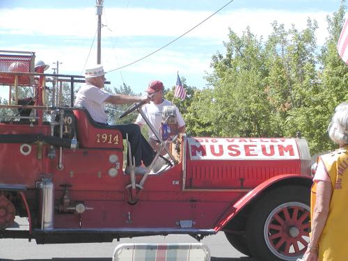 Old Carl Parks driving the museum Bieber Fire Truck.