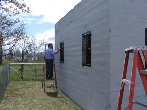 Painting the jail bars from the outside