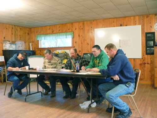 5 members of the Adin Fire District at the meeting table.