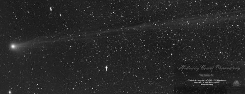 The new comet streaching across a background of stars.