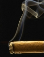 A smoking cigar on a black backgtound