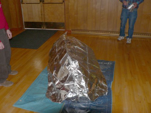 What looks like an aluminum foil caterpillar is a man inside the Fire Protector