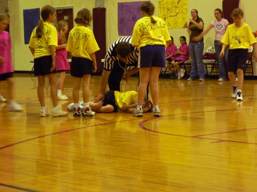 An injured lady player with her teammates.