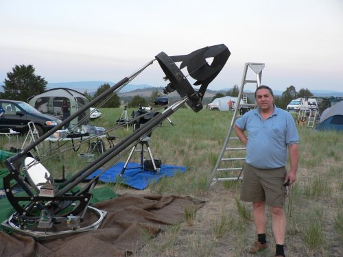 Dan Gray shows off telescope he uses for infrared star measurements.