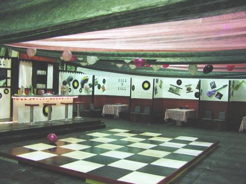 The inside of the gymnasium as decorated with the 50's style disco theme.